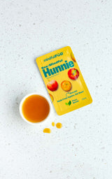 A single-serve sachet of Bee-Mindful Hunnie.